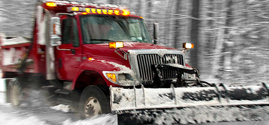 A large municipality snow plow easily handles snow and ice on the eastcoast with lighting from Whelen.