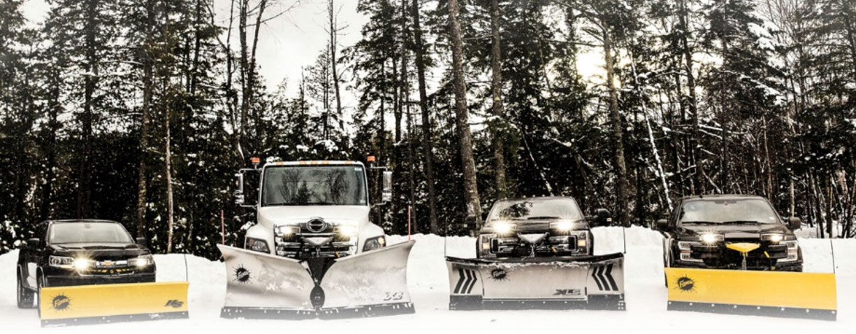 Fisher snow plows mounted on four work vehicles